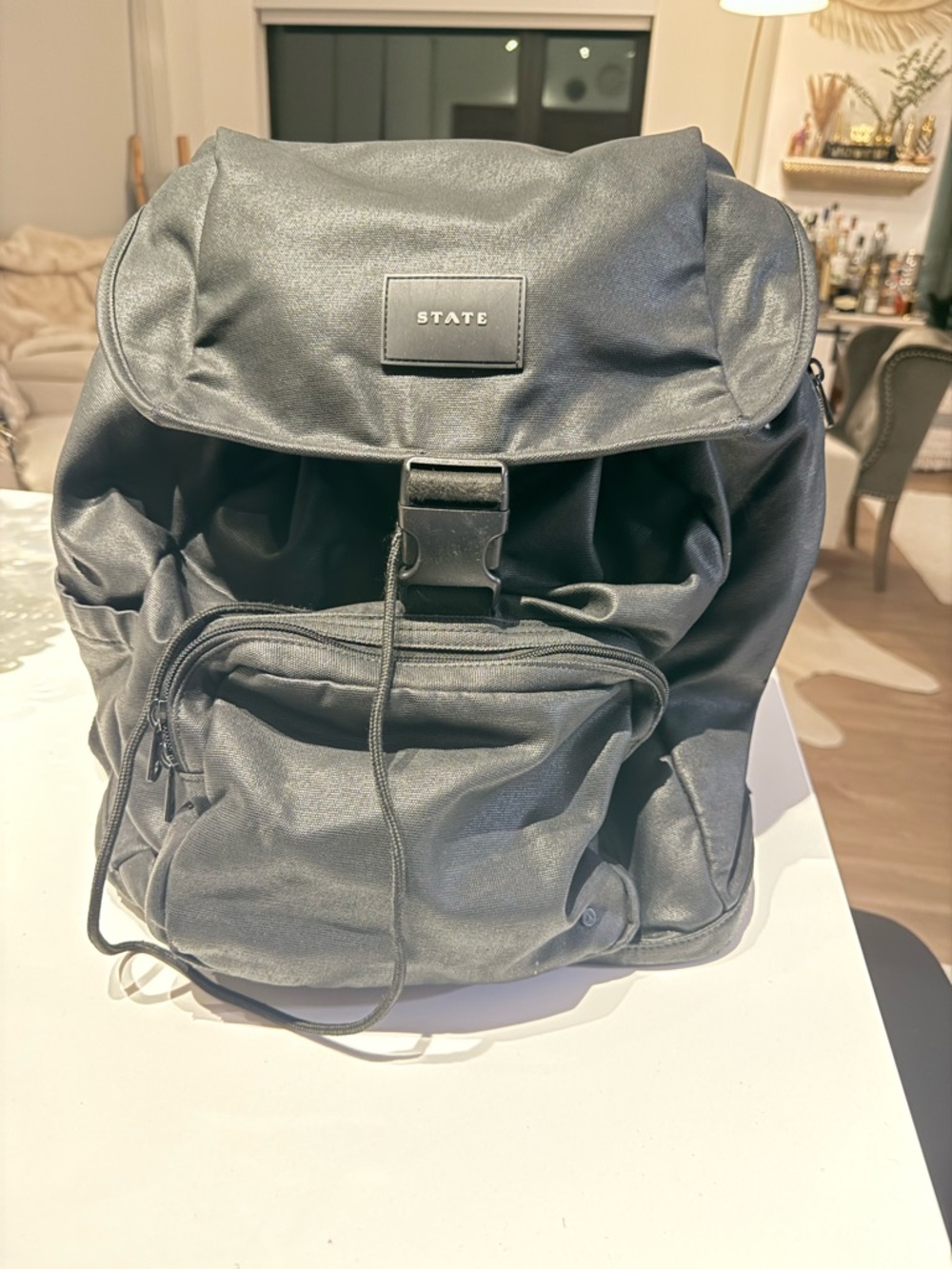 STATE Black Backpack with Front Buckle and Zip Pocket. Unisex